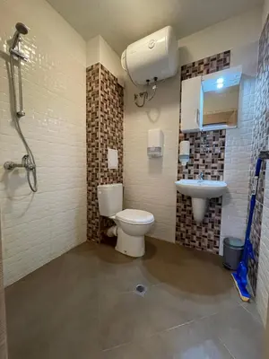 a bathroom with a toilet and a sink at Colonel apartment 937 in Sofia