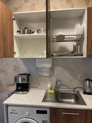 a kitchen with a sink and a washing machine at Colonel apartment 937 in Sofia