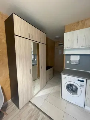 a kitchen with a washer and dryer in a room at Colonel apartment 954 in Sofia