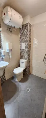 a bathroom with a toilet and a sink at Colonel apartment 954 in Sofia