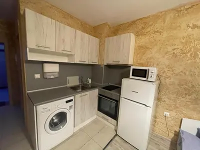 a small kitchen with a refrigerator and a microwave at Colonel apartment 956 in Sofia