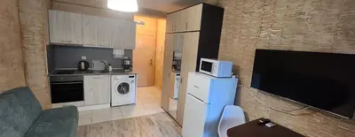 a small kitchen with a refrigerator and a microwave at Colonel apartment 959 in Sofia