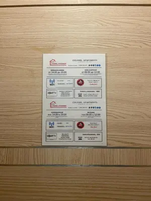 a piece of paper on a wooden door at Colonel apartment 959 in Sofia