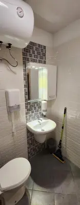 a bathroom with a white toilet and a sink at Colonel apartment 959 in Sofia