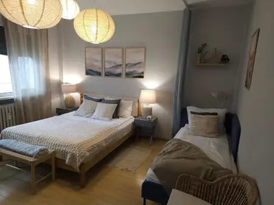a bedroom with two beds and two lamps at S íRMA Apartment - The Soul of Central Sofia in Sofia