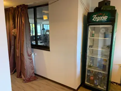 an open refrigerator in the corner of a room at 7 apartments in Alexander complex in Bansko