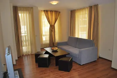 a living room with a couch and a coffee table at Spider House Aparthotel in Pamporovo