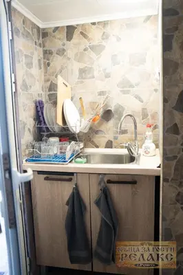 a kitchen with a sink and a counter top at Къща за гости Рупите , Guest House Relax Rupite in Rupite