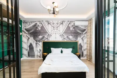 a bedroom with a bed and a wall mural at Heart of the City Center Lux Apartment2 with View in Sofia