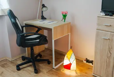 a desk with a chair and a desk with a stained glass window at The Top Spot - Cute Little Studio in the Center by Flat Mаnager in Sofia
