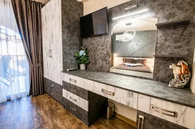 a bedroom with a vanity with a mirror and a dog statue at Luxe Apartment Grand Monastery in Pamporovo in Pamporovo