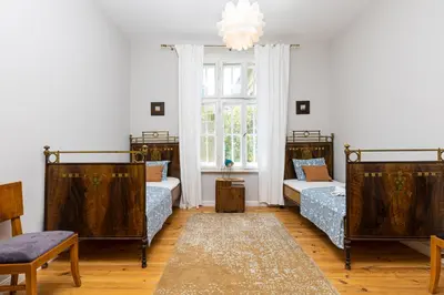 a room with three beds and a window at The Old Town Vintage 2-Bedroom Jewel by Flat Mаnager in Plovdiv