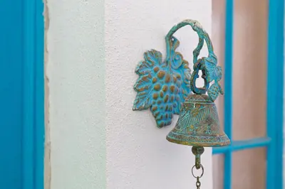 a bell is hanging on a wall at The Old Town Vintage 2-Bedroom Jewel by Flat Mаnager in Plovdiv