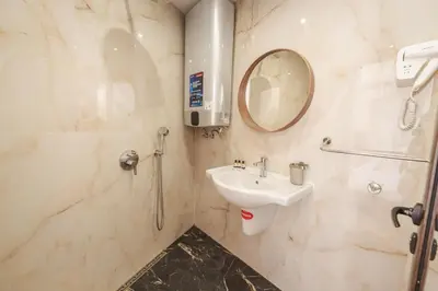 a bathroom with a sink and a mirror at апартаменти Пасажио in Sandanski