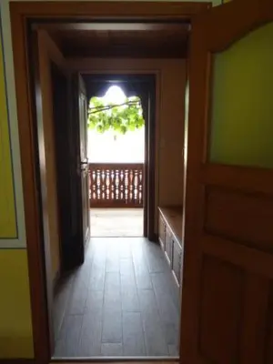 a hallway with a door leading to a porch at Недкова къща in Koprivshtitsa