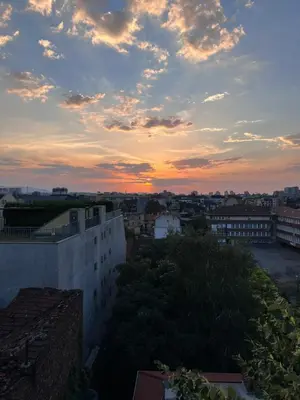 a view of a city at sunset from a building at Dalv Residence - SPA Fairy Tale in old Sofia in Sofia