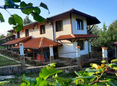 a house with a fence in front of it at Райчевата къща - Кюстендил in Kyustendil