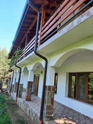 a building with a pipe on the side of it at Райчевата къща - Кюстендил in Kyustendil