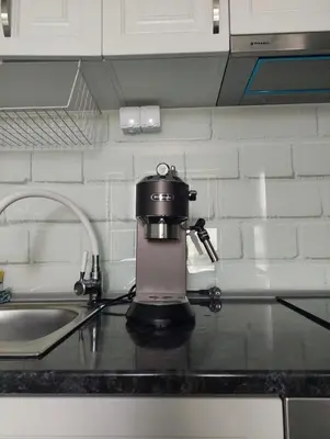 a coffee maker sitting on a kitchen counter at Mountain View Apartment 1 + Parking in Sofia