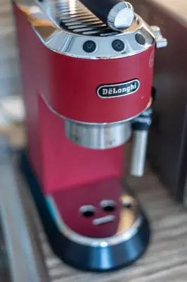 a red blender sitting on top of a counter at City View Apartment + Parking in Sofia