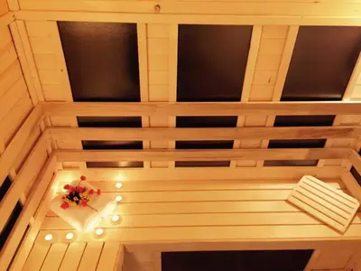 a ceiling with lights and a flower on it at ENIS Hotel със закрит и отоплен минерален басейн in Sapareva Banya