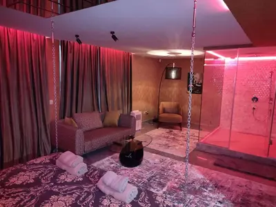 a room with a shower with a couch and a chair at Кокиче 3 in Sofia