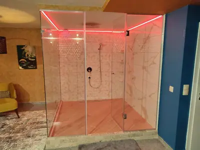 a shower with a glass enclosure in a room at Кокиче 3 in Sofia