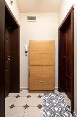 a bedroom with a wooden chest of drawers at Centrally-located 1BD Apartment near Kapana by Flat Mаnager in Plovdiv