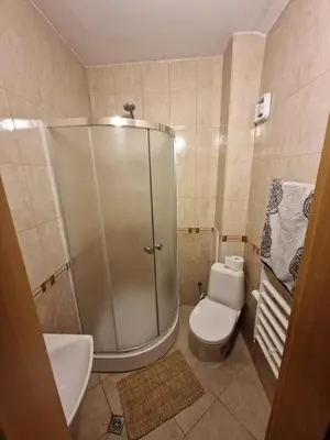 a bathroom with a shower with a toilet and a sink at Mountain View Resort - Apartment B45 in Bansko