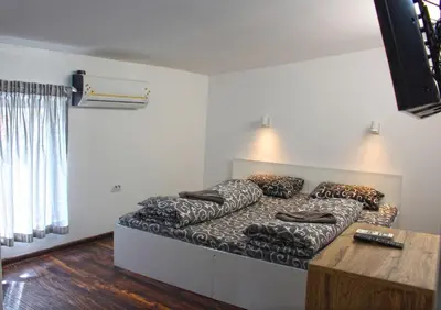 a large bed in a room with at The rainbow 4 in Sofia
