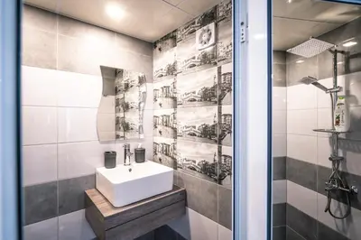 a bathroom with a sink and a shower at The moon in Sandanski