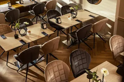 a row of tables and chairs in a restaurant at -- ESTE PARK HOTEL -- part of Urban Chic Luxury Design Hotels - Parking & Compliments - next to Shopping & Dining Mall Plovdiv in Plovdiv