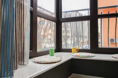 two pillows sitting on a window sill in front of a window at Trendy & Deluxe Apartment by Flat Mаnager in Plovdiv
