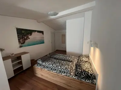 a bedroom with a black and white bed in a room at The rainbow 5 in Sofia