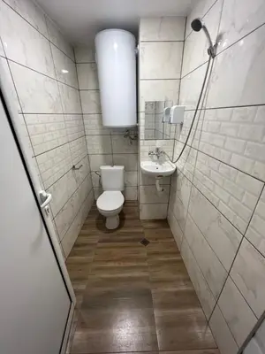 a bathroom with a toilet and a sink at The rainbow 6 in Sofia