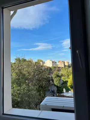 a window with a view of a city at The rainbow 6 in Sofia