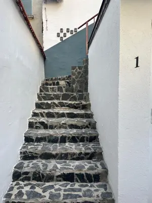 a stairway with stone steps in a building at The rainbow 6 in Sofia