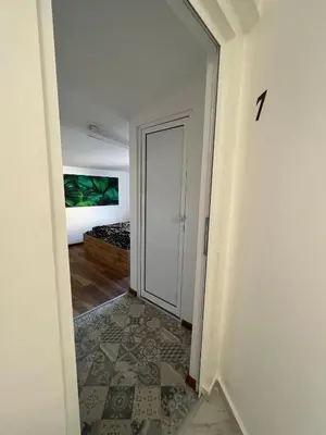 a hallway with a door leading to a bedroom at The rainbow 7 in Sofia