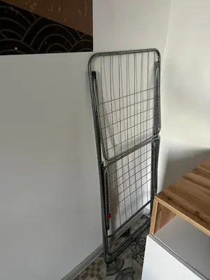 a shopping cart in a kitchen next to a wall at The rainbow 3 in Sofia