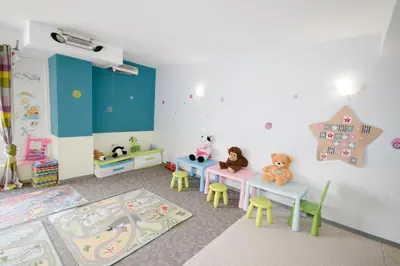 a childs room with two tables and a playroom with toys at Saint George Palace Deluxe Collection in Bansko