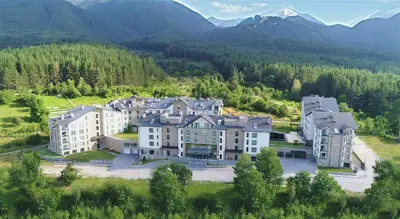 an aerial view of a large building in the mountains at Saint George Palace Deluxe Collection in Bansko