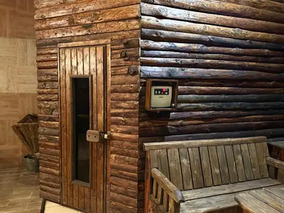 a wall of a log cabin with a door at Penthouse at Dream Bansko in Bansko
