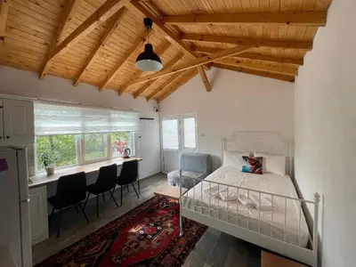 a bedroom with a bed and a dining room with a table at Cozy Home in Ardino in Ardino