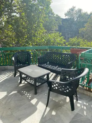 two benches and a table on a patio at Central Studio with Lovely Terrace & Free street Parking in Plovdiv