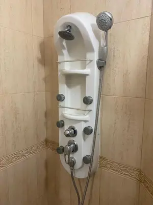 a shower with a shower head in a bathroom at Central Studio with Lovely Terrace & Free street Parking in Plovdiv