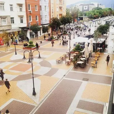 a group of people walking on a city street at Top Center Studio 1 in Sofia