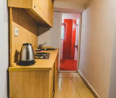 a kitchen with a sink and a kettle on a counter at Top Center Apartment 2 in Sofia