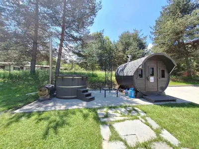 a tiny house in a yard with a grill at Вила Bora Vista 1 in Tsigov Chark