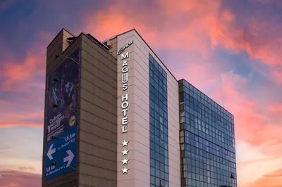 a tall building with a sky in the background at Art Magus Hotel in Sofia