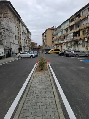 a street with cars parked on the side of the road at 3 Rooms Apartment, Top Center, 1st Floor Flat, AUBG, WiFi, PC i5 SSD, Tablet, AndroidMiTvBox, 3 LED TVs 200 Channels, Long Terrace, Self-Easy-Late Check-in, Stay Before Greece in Blagoevgrad